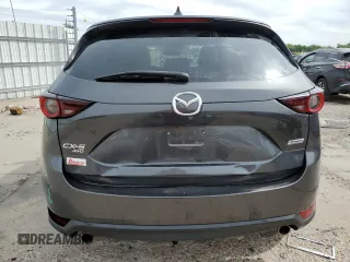 2018 Mazda CX-5 Touring z VIN JM3KFBCM2J0379190, wystawiony jako Copart lot #59233075 z przebiegiem 51 985 mil mil oraz Szkoda całkowita • Salvage title. Historia ofert i sprzedaży dostępna na DreamBid. Obrazek 6.