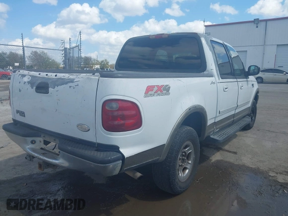 2002 Ford F-150 XLT with VIN 1FTRW08L02KA10457, listed as a IAAI auction lot 41704625 with 151,072 mi miles. Bid and sale history available at carsss.com. Image 4.