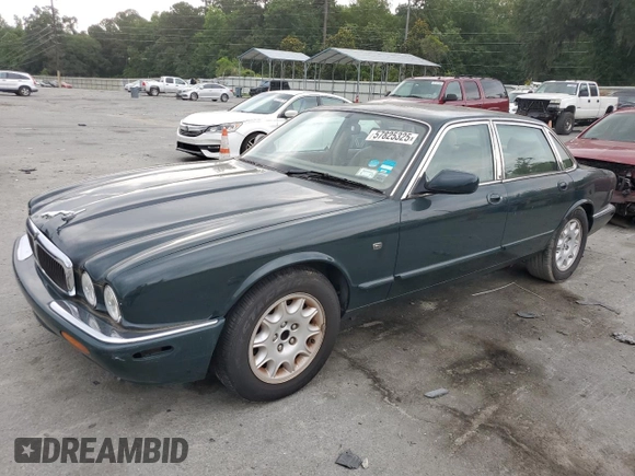 1999 Jaguar XJ with VIN SAJHX1044XC865054, listed as a Copart auction lot 57825325 with 71,145 mi miles and Clean title. Bid and sale history available at DreamBid. Image 1.
