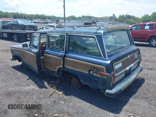 1988 Jeep Grand Wagoneer with VIN 1JCNJ15U7JT237152, listed as a IAAI auction lot 42682009 with 159,950 mi miles and . Bid and sale history available at DreamBid. Image 3.