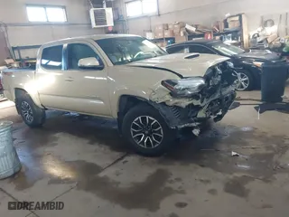 2020 Toyota Tacoma 4WD SR5 with VIN 3TMCZ5AN1LM318866, listed as a IAAI auction lot 41619290 with 69,973 mi miles. Bid and sale history available at carsss.com. Image 1.