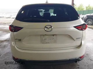 2019 Mazda CX-5 Grand Touring with VIN JM3KFBDMXK0648813, listed as a IAAI auction lot 42524680 with 23,521 mi miles and . Bid and sale history available at DreamBid. Image 17.