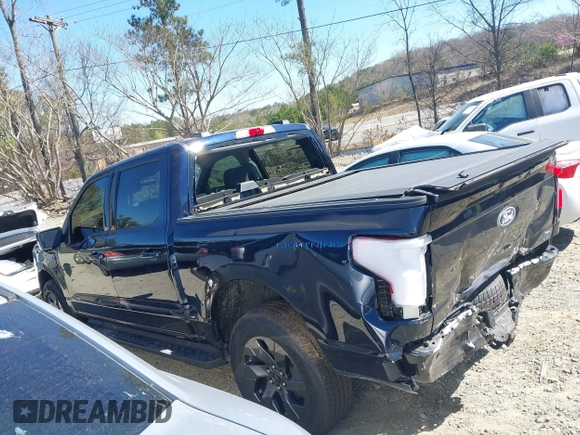 2024 Ford F-150 Lightning Flash with VIN 1FT6W3L75RWG30755, listed as a IAAI auction lot 41817158 with 1,932 mi miles and . Bid and sale history available at DreamBid. Image 14.