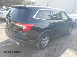 2020 Honda Pilot EX-L with VIN 5FNYF5H52LB003289, listed as a IAAI auction lot 41563075 with 151,682 mi miles. Bid and sale history available at carsss.com. Image 4.