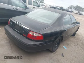 2004 Mercury Sable GS with VIN 1MEFM50U34G613224, listed as a IAAI auction lot 42079216 with 202,360 mi miles. Bid and sale history available at carsss.com. Image 4.