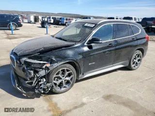 2018 BMW X1 sDrive28i with VIN WBXHU7C31J5H39068, listed as a Copart auction lot 49018985 with 100,611 mi miles and Salvage Title. Bid and sale history available at carsss.com. Image 1.