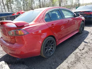 2011 Mitsubishi Lancer ES with VIN JA32U2FU3BU036133, listed as a IAAI auction lot 41970838 with 142,838 mi miles. Bid and sale history available at carsss.com. Image 4.