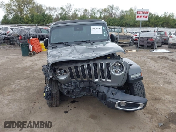 2022 Jeep Wrangler Unlimited Sahara with VIN 1C4HJXEG7NW138105, listed as a IAAI auction lot 42146898 with Not provided miles and . Bid and sale history available at DreamBid. Image 13.