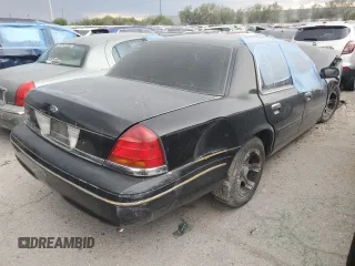 2000 Ford Crown Victoria LX с VIN 2FAFP74W1YX130479, выставлен на аукционе Copart как лот 53387815 с пробегом 166 089 миль миль и На запчасти • Non repairable. История ставок и продаж доступна на DreamBid. Изображение 3.