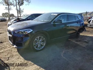 2019 BMW X2 sDrive28i with VIN WBXYJ3C50KEP77537, listed as a Copart auction lot 79687114 with 56,862 mi miles and Salvage Title. Bid and sale history available at carsss.com. Image 1.