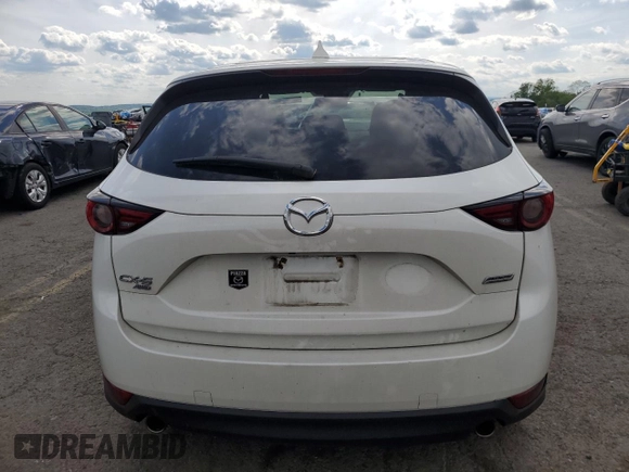 2018 Mazda CX-5 Grand Touring z VIN JM3KFBDM6J0447165, wystawiony jako Copart lot #56133015 z przebiegiem 80 579 mil mil oraz Szkoda całkowita • Salvage title. Historia ofert i sprzedaży dostępna na DreamBid. Obrazek 6.