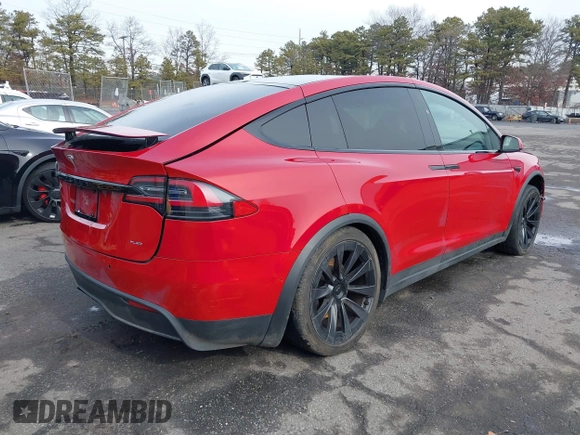 2022 Tesla Model X Plaid with VIN 7SAXCBE60NF330246, listed as a IAAI auction lot 41477394 with 51,612 mi miles and . Bid and sale history available at DreamBid. Image 4.