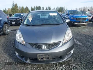 2011 Honda Fit Sport z VIN JHMGE8H54BC000162, wystawiony jako IAAI lot #41665321 z przebiegiem 154 531 mil mil oraz . Historia ofert i sprzedaży dostępna na DreamBid. Obrazek 13.