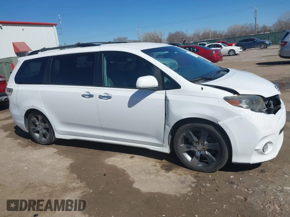 2014 Toyota Sienna SE with VIN 5TDXK3DC0ES477207, listed as a IAAI auction lot 41624619 with 213,881 mi miles and . Bid and sale history available at DreamBid. Image 13.