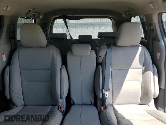 2015 Toyota Sienna XLE with VIN 5TDYK3DC4FS619385, listed as a Copart auction lot 57090385 with 112,896 mi miles and Salvage title. Bid and sale history available at DreamBid. Image 10.