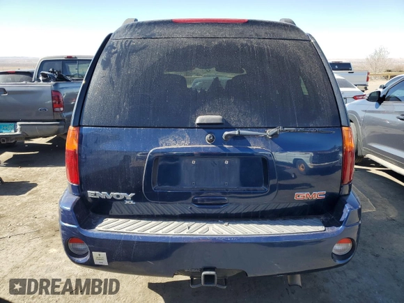 2003 GMC Envoy SLT z VIN 1GKET16S436169701, wystawiony jako Copart lot #44390805 z przebiegiem 168 236 mil mil oraz Szkoda całkowita • Salvage title. Historia ofert i sprzedaży dostępna na DreamBid. Obrazek 6.