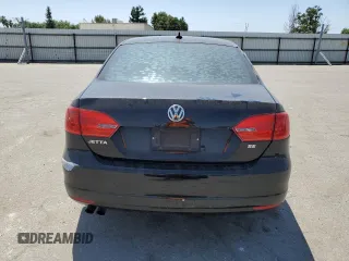 2014 Volkswagen Jetta SE with VIN 3VWD17AJ0EM268515, listed as a Copart auction lot 59977225 with 163,365 mi miles and Salvage title. Bid and sale history available at DreamBid. Image 6.