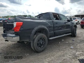 2016 Nissan Titan SL z VIN 1N6BA1F22GN504550, wystawiony jako Copart lot #56616955 z przebiegiem 176 020 mil mil oraz Szkoda całkowita • Salvage title. Historia ofert i sprzedaży dostępna na DreamBid. Obrazek 3.