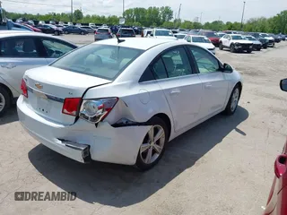 2014 Chevrolet Cruze 2LT z VIN 1G1PE5SBXE7168795, wystawiony jako IAAI lot #42285484 z przebiegiem 104 317 mil mil oraz . Historia ofert i sprzedaży dostępna na DreamBid. Obrazek 4.