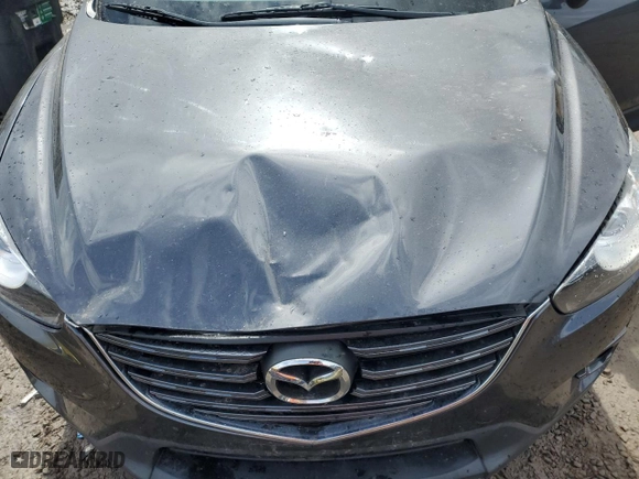 2016 Mazda CX-5 Touring with VIN JM3KE4CY3G0801168, listed as a Copart auction lot 50296055 with 88,568 mi miles and Salvage Title. Bid and sale history available at carsss.com. Image 12.