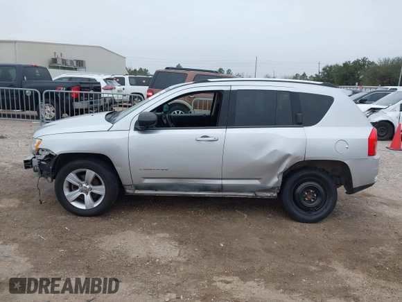 2011 Jeep Compass with VIN 1J4NT1FA7BD142600, listed as a IAAI auction lot 41590661 with 266,600 mi miles. Bid and sale history available at carsss.com. Image 15.