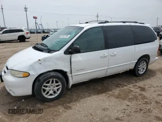2000 Dodge Caravan SE with VIN 1B4GP44G7YB636078, listed as a Copart auction lot 59387395 with 184,916 mi miles and Salvage title. Bid and sale history available at DreamBid. Image 1.
