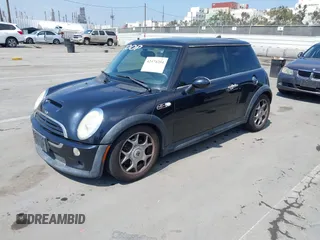 2006 MINI Hardtop S with VIN WMWRE33596TJ35502, listed as a IAAI auction lot 42474204 with 126,938 mi miles and . Bid and sale history available at DreamBid. Image 2.