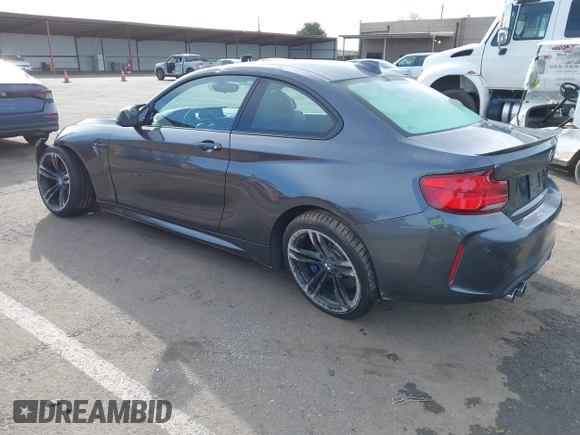 2018 BMW M2 with VIN WBS1J5C50JVE51869, listed as a IAAI auction lot 41814404 with 69,684 mi miles. Bid and sale history available at carsss.com. Image 3.