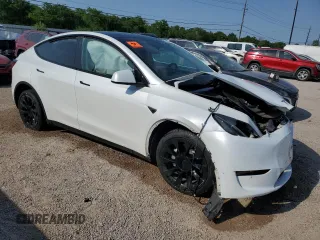 2023 Tesla Model Y Long Range with VIN 7SAYGDEE6PA053274, listed as a Copart auction lot 52865175 with Not Provided miles and Salvage Title. Bid and sale history available at DreamBid. Image 4.