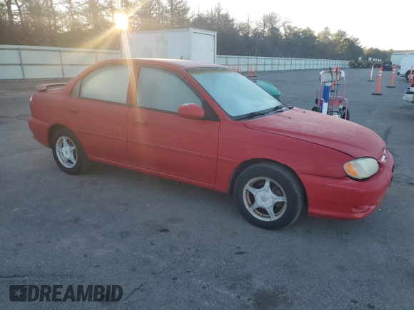 2001 Kia Sephia z VIN KNAFB121715066725, wystawiony jako Copart lot #86552964 z przebiegiem 76 915 mil mil oraz Tytuł czysty. Historia ofert i sprzedaży dostępna na DreamBid. Obrazek 4.
