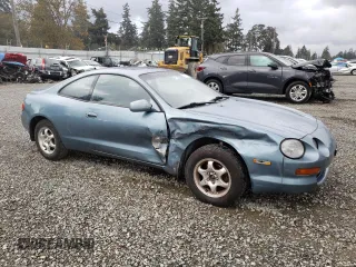 1995 Toyota Celica ST with VIN JT2AT00N7S0047304, listed as a Copart auction lot 77003784 with 423,438 mi miles and Salvage Title. Bid and sale history available at carsss.com. Image 4.
