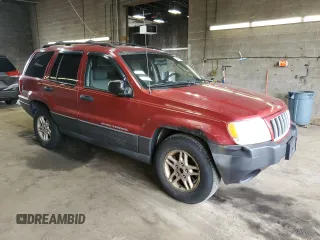 2004 Jeep Grand Cherokee Laredo with VIN 1J4GW48S04C164745, listed as a Copart auction lot 64036725 with 163,054 mi miles and Salvage title. Bid and sale history available at DreamBid. Image 4.