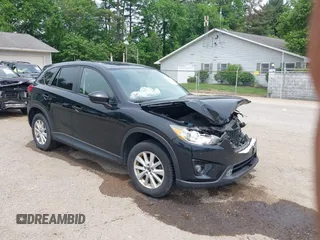 2014 Mazda CX-5 Touring z VIN JM3KE4CY7E0329781, wystawiony jako IAAI lot #42260024 z przebiegiem 156 187 mil mil oraz . Historia ofert i sprzedaży dostępna na DreamBid. Obrazek 1.