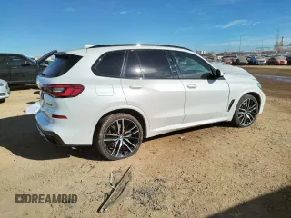 2020 BMW X5 M50i with VIN 5UXJU4C00L9B77869, listed as a Copart auction lot 36123043 with 27,195 mi miles. Bid and sale history available at carsss.com. Image 3.