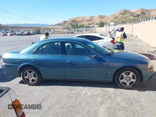 2001 Lincoln LS w/Base Pkg with VIN 1LNHM87A31Y617332, listed as a IAAI auction lot 41317767 with 141,931 mi miles. Bid and sale history available at carsss.com. Image 13.