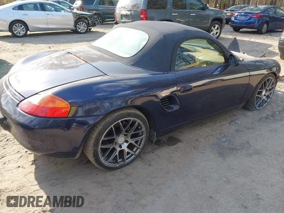 2001 Porsche Boxster with VIN WP0CA29841U626899, listed as a IAAI auction lot 41695245 with 138,097 mi miles. Bid and sale history available at carsss.com. Image 4.