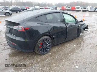 2023 Tesla Model Y Performance z VIN 7SAYGDEF0PF715703, wystawiony jako IAAI lot #41869780 z przebiegiem 32 220 mil mil oraz . Historia ofert i sprzedaży dostępna na DreamBid. Obrazek 4.