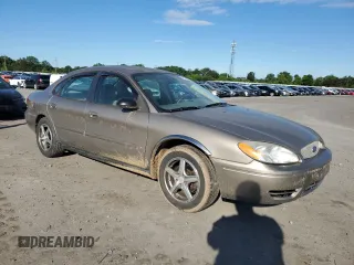 2004 Ford Taurus SE z VIN 1FAFP53284A156633, wystawiony jako Copart lot #58164985 z przebiegiem 91 246 mil mil oraz Szkoda całkowita • Salvage title. Historia ofert i sprzedaży dostępna na DreamBid. Obrazek 4.