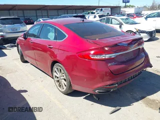 2017 Ford Fusion Titanium with VIN 3FA6P0K90HR184777, listed as a IAAI auction lot 41722188 with 116,654 mi miles. Bid and sale history available at carsss.com. Image 3.