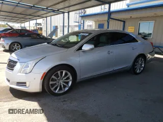 2016 Cadillac XTS Luxury Collection with VIN 2G61M5S38G9209633, listed as a Copart auction lot 65090595 with 114,825 mi miles and Salvage title. Bid and sale history available at DreamBid. Image 1.