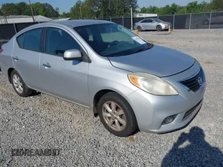 2012 Nissan Versa SV with VIN 3N1CN7APXCL867337, listed as a IAAI auction lot 42079349 with 260,442 mi miles. Bid and sale history available at carsss.com. Image 1.