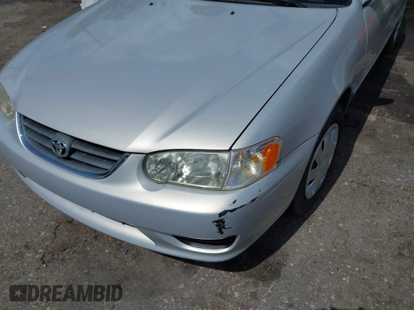 2002 Toyota Corolla CE with VIN 1NXBR12E12Z581660, listed as a IAAI auction lot 42654124 with 115,950 mi miles and . Bid and sale history available at DreamBid. Image 6.