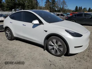 2023 Tesla Model Y Long Range z VIN 7SAYGDEE7PF788932, wystawiony jako Copart lot #52822515 z przebiegiem 33 007 mil mil oraz Szkoda całkowita • Salvage title. Historia ofert i sprzedaży dostępna na DreamBid. Obrazek 4.