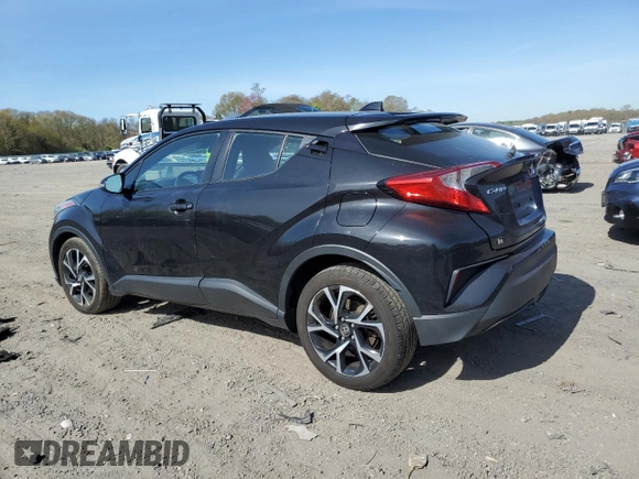 2021 Toyota C-HR LE z VIN NMTKHMBX2MR133802, wystawiony jako Copart lot #54398745 z przebiegiem 152 133 mil mil oraz Szkoda całkowita • Salvage title. Historia ofert i sprzedaży dostępna na DreamBid. Obrazek 2.