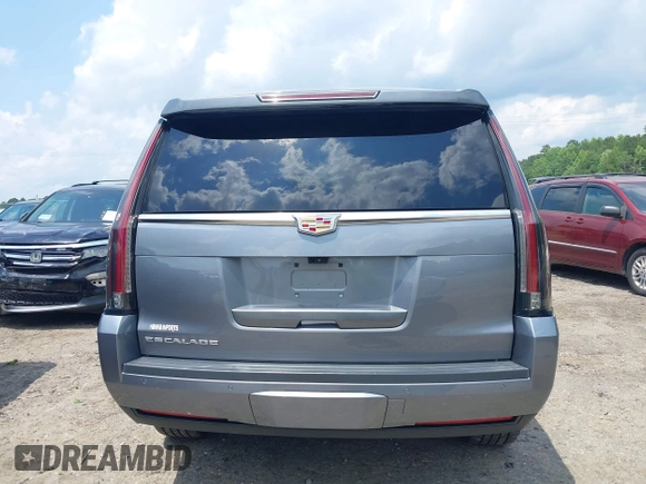 2020 Cadillac Escalade Luxury z VIN 1GYS3BKJ0LR116410, wystawiony jako IAAI lot #42274841 z przebiegiem 75 513 mil mil oraz . Historia ofert i sprzedaży dostępna na DreamBid. Obrazek 16.