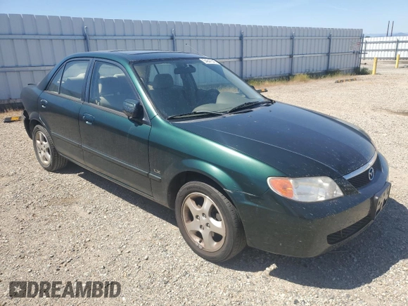 2002 Mazda Protege DX with VIN JM1BJ225121567924, listed as a Copart auction lot 54847545 with 93,653 mi miles and Salvage Title. Bid and sale history available at DreamBid. Image 4.