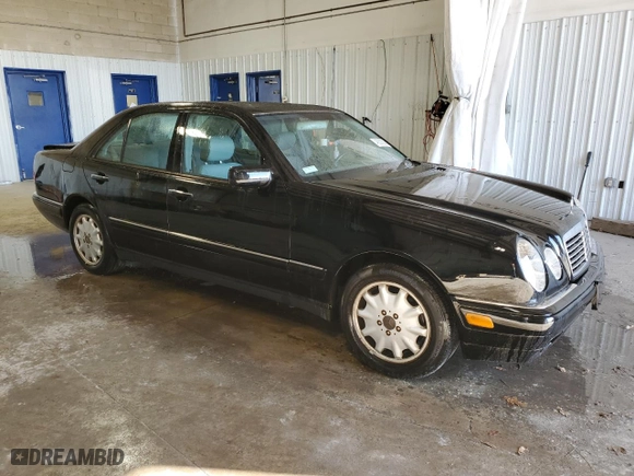 1999 Mercedes-Benz E-Class with VIN WDBJF65H1XA746402, listed as a Copart auction lot 48303385 with 156,461 mi miles and Salvage Title. Bid and sale history available at carsss.com. Image 4.