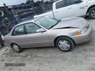 1998 Toyota Corolla VE z VIN 2T1BR18EXWC015480, wystawiony jako IAAI lot #41959316 z przebiegiem 224 304 mil mil oraz . Historia ofert i sprzedaży dostępna na DreamBid. Obrazek 13.