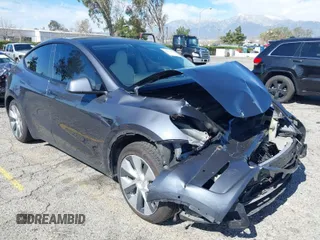 2022 Tesla Model Y Long Range with VIN 7SAYGAEEXNF381389, listed as a IAAI auction lot 41613075 with 52,800 mi miles and . Bid and sale history available at carsss.com. Image 1.