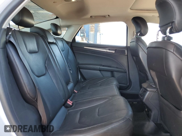 2013 Ford Fusion Titanium Hybrid z VIN 3FA6P0RUXDR376633, wystawiony jako Copart lot #57685555 z przebiegiem 133 248 mil mil oraz Szkoda całkowita • Salvage title. Historia ofert i sprzedaży dostępna na DreamBid. Obrazek 10.